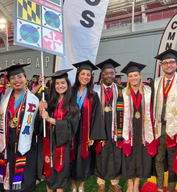 Juliza at commencement ceremony with other BSOS grads