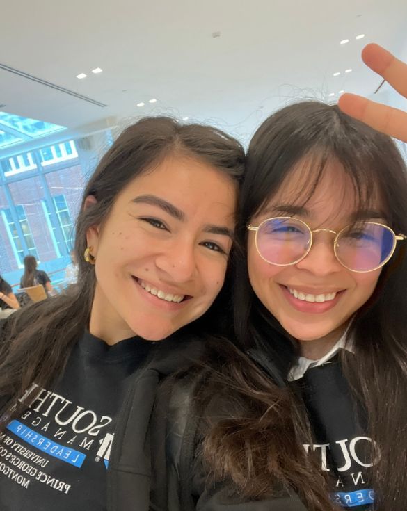 Juliza and Jeymi take a selfie wearing SMLP shirts